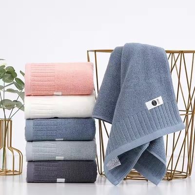 Asciugamano da bagno di cotone morbido e di peluche con design a strisce semplici a doppio lato