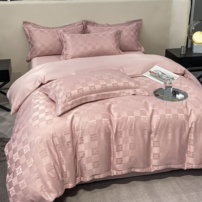 Sette di biancheria da letto di lusso a modello solido per biancheria da letto leggera di lusso satinata Jacquard a 4 pezzi
