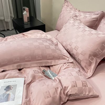 Sette di biancheria da letto di lusso a modello solido per biancheria da letto leggera di lusso satinata Jacquard a 4 pezzi