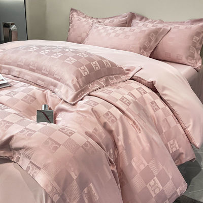 Sette di biancheria da letto di lusso a modello solido per biancheria da letto leggera di lusso satinata Jacquard a 4 pezzi