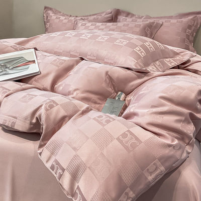 Sette di biancheria da letto di lusso a modello solido per biancheria da letto leggera di lusso satinata Jacquard a 4 pezzi